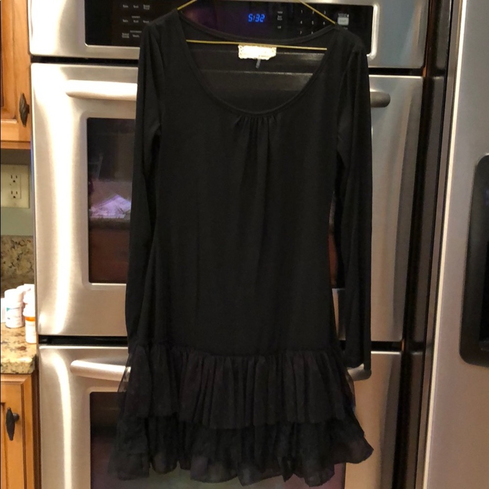 Women’s ruffle dress/tunic (vest sold separate).